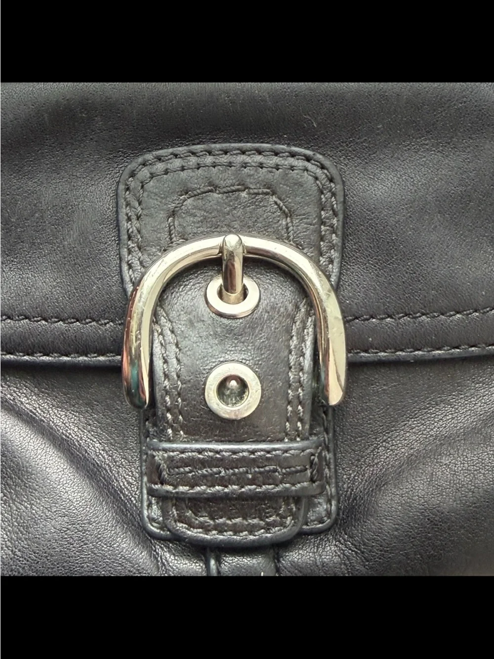 Coach, Soho, wristlet Black Leather Wristlet with Buckle Detail excellent condi